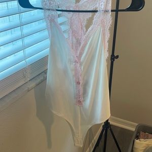 Pink lace and white body suit